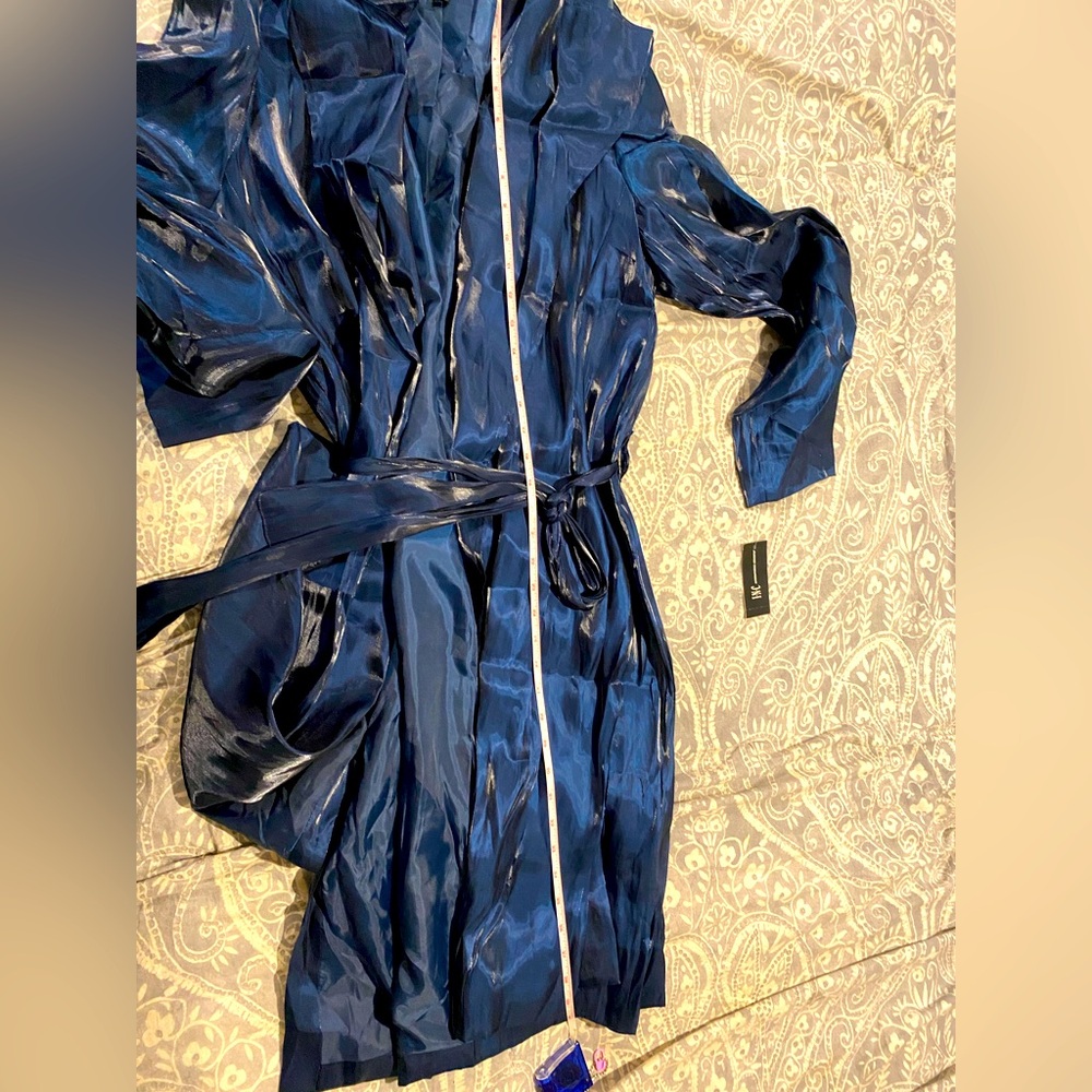 Brilliant navy blue trench coat for spring. Brand new w tags. Sleek satin look.